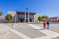 Couple leaving the mass in the Saint Adrian Mother Church, Portugal. Royalty Free Stock Photo